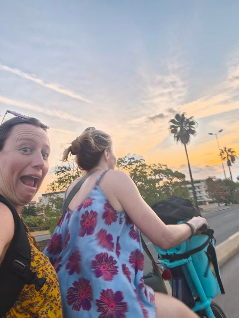 riding along Nice promenade on a double pony bike - one of the best things to do in Nice